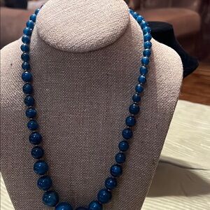 Radiant Blue Gemstone Necklace with Intricate Detailing